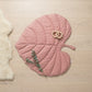Pink Leaf playmat flatlay on linen — Natural Nursery tummy time