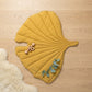Yellow Leaf playmat flatlay on linen — Natural Nursery tummy time