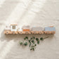 Wooden train playset on linen — Natural Nursery beech wood Montessori toy